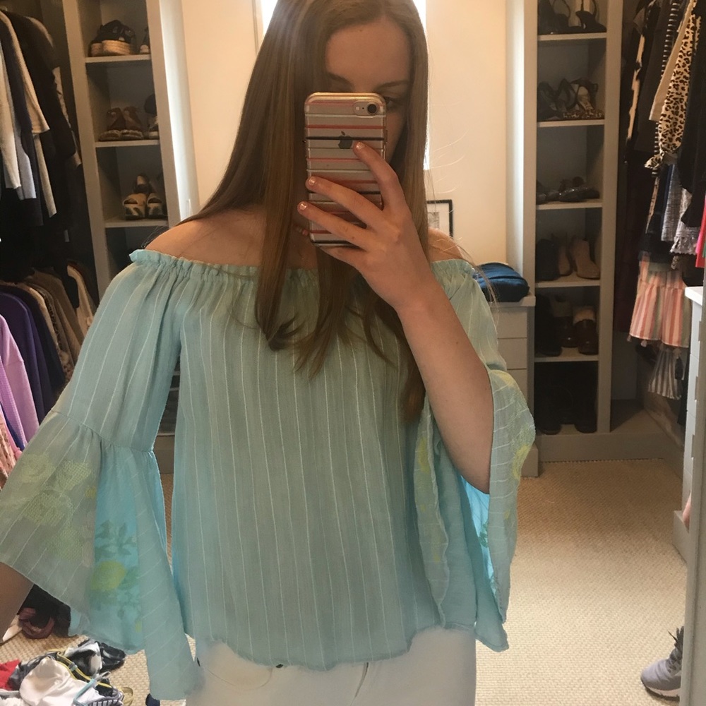 blue embroidered off the shoulder shirt